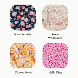 May include: Four square fabric swatches with rounded corners. Top left: Navy Peonies with pink and white flowers. Top right: Sweet Woodlands with forest animals. Bottom left: Flower Power with orange and yellow daisies. Bottom right: Hello Kitty with pink icons.