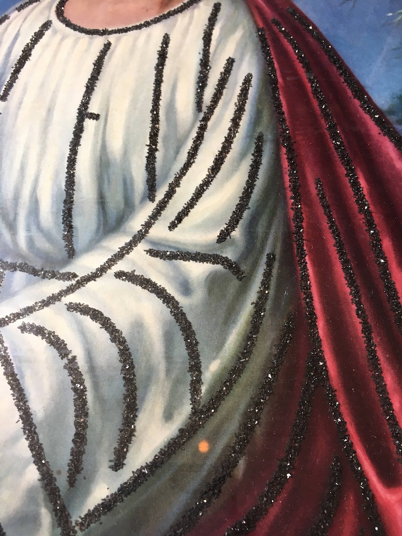 May include: A close-up of a painting of a person wearing a white robe with black trim and a red robe with black trim. The painting is done in a traditional style and has a vintage feel.