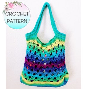 May include: A handmade, open-weave crochet tote bag in a vibrant rainbow of colors, including green, yellow, blue, and purple. The bag features long handles and the text "CROCHET PATTERN" in a circular design.