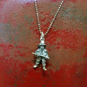 925 sterling silver Firefighter with axe charm on an 18 inch sterling silver chain.