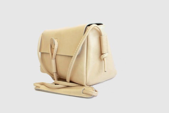 cream messenger bag