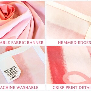 May include: A pink fabric banner with a floral design. The banner features the text "DURABLE FABRIC BANNER", "HEMMED EDGES", "MACHINE WASHABLE", and "CRISP PRINT DETAILS". The banner is made of 100% polyester.