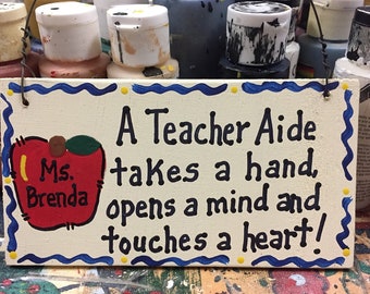 Teacher Gifts st5201  A Teacher Aide takes a hand,opens a mind, and touches a heart