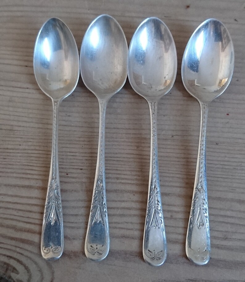 Four vintage sterling silver teaspoons