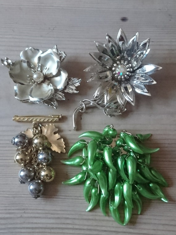 Four large vintage brooches