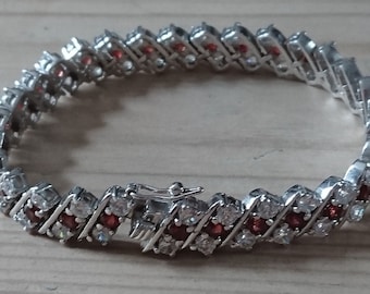 Sterling silver and garnet tennis bracelet