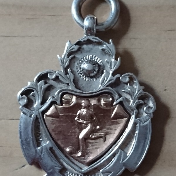 Vintage solid sterling silver football medallion