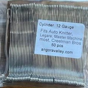 May include: Two clear plastic bags containing silver-colored knitting machine needles. Each bag has a label that reads "Cylinder 12 Gauge" and lists compatible machines. The labels also state "50 pcs" and "angoravalley.com".