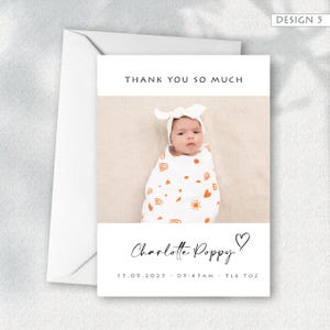 May include: A white card with a baby photo, orange sun and rainbow designs, and the text "THANK YOU SO MUCH." The card also includes the name "Charlotte Poppy," a heart symbol, and birth details: 15.09.2025 - 09:45 AM - 9LB 7OZ.
