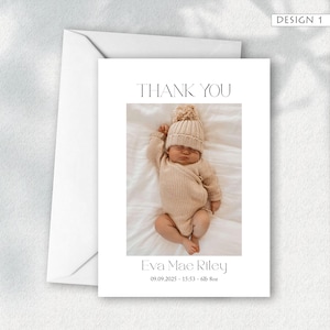 May include: A white card with a photograph of a newborn baby wearing a beige knit hat and onesie. The text "THANK YOU" is above the photo, and the baby's name, birthdate, and weight are below. An envelope is on the left.
