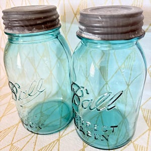 2 vintage Aqua blue ball canning jars with zinc lids