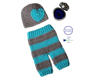 May include: Crochet pattern for a baby hat and trousers set. The hat is grey with a blue heart on top. The trousers are grey and blue striped. The pattern is called "Gigi's Blue Rose".