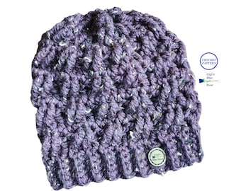 May include: A purple crocheted beanie hat with a white flecked yarn. The hat has a small tag with the text "Gigi's Blue Rose" on it.