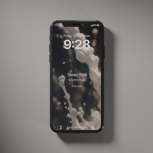 May include: A black smartphone with a white screen displaying a sleep mode notification. The screen shows the time 9:28, the date Friday, 18 November, and the text "Sleep Well". The notification includes icons for "Do Not Disturb" and "No Alarm".