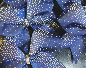 Ribbon bonded cheer bow in your color choice with rhinestone fade pattern