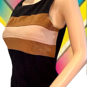 May include: A sleeveless dress with a black base and horizontal stripes of brown, pink, and tan suede.