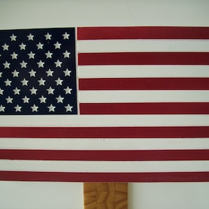 The American Flag engraved into 6&quot; by 10&quot; PVC, display it on any wall.