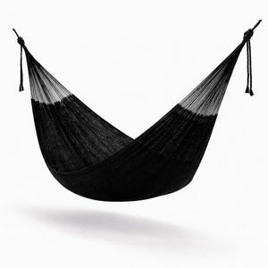 May include: A black hammock made of woven material, suspended against a white background. The hammock has a curved shape, with ropes tied at each end for hanging. The design features a solid black center with a lighter, almost white, border.