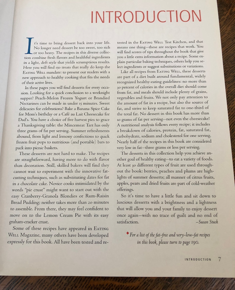 May include: A book cover with the title "Introduction" and the number "7" on the bottom right corner. The book cover is white with black text and a small black star in the top right corner. The text on the cover discusses the importance of healthy eating and provides tips for making delicious desserts that are low in fat.