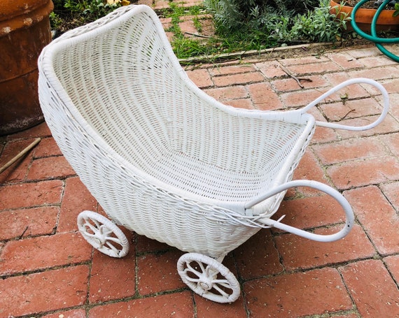 white wicker doll carriage