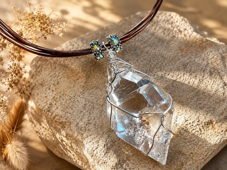 Handmade lodolite quartz necklace with a large faceted garden quartz pendant, silver wire wrapping, iridescent crystal beads and brown leather cords.