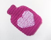 Crochet hot water bottle cover/cosy in Pink, with white heart cross stitch decoration