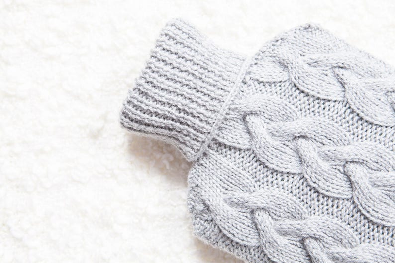 Hand knitted hot water bottle cover / cozy in light grey. Rustic bedroom / home decor that makes a perfect handmade Christmas gift. Hygge image 2