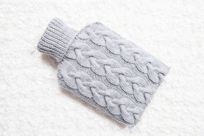 Hand knitted hot water bottle cover / cozy in light grey. Rustic bedroom / home decor that makes a perfect handmade Christmas gift. Hygge image 1