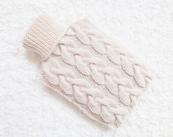 Hand knitted hot water bottle cover / cozy in cream. Rustic bedroom / home decor that makes a perfect handmade Christmas gift. Hygge!