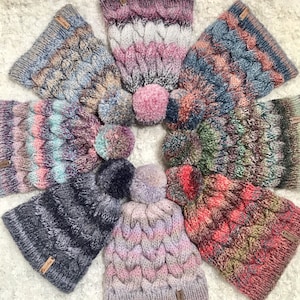 Colourful hand knitted cable pom pom hat. Women&#39;s thick chunky bobble beanie. Various colours, variegated yarn, textured winter accessory.