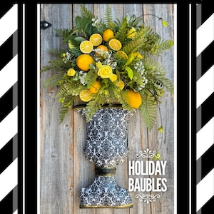 May include: A decorative urn filled with lemons, roses, and greenery, set against a weathered wood background. The urn has a black and white damask pattern. Text at the top reads "DIGITAL TUTORIAL" and "HOLIDAY BAUBLES" at the bottom.