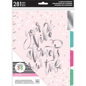 May include: Pink calendar extension with silver foil lettering that reads "Your vibe attracts your tribe". The extension has a grid pattern and white confetti. It is a 6-month undated extension.
