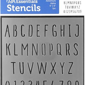 May include: A gray plastic stencil with the alphabet and numbers 0-9. The stencil is 6 inches by 6 inches and is part of the Adventure Alpha stencil collection.