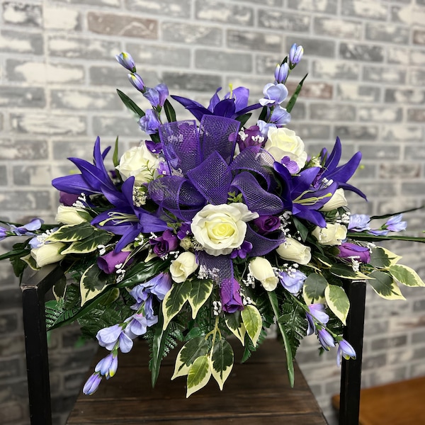 Memorial Day cemetery saddle -  tombstone arrangement, purple& cream mix flowers with purple ribbon. Spring cemetery flowers- Veterans Day