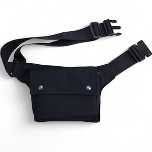 Handy hip bag with enough pockets, made of organic cotton, closing with a strong black click buckle