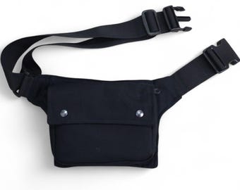 Handy hip bag with enough pockets, made of organic cotton, closing with a strong black click buckle