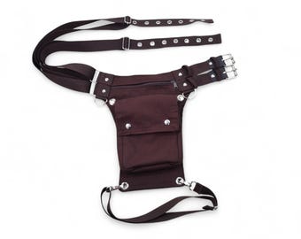 Brown cotton side leg bag with a leg strap on the thigh and 2 belt buckles at the waist. For cosplay, the belts are also brown.