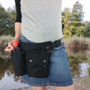 Hip bag with an extra water bottle pocket, made of black organic cotton, also in all plus sizes, sturdy plastic click buckle or metal buckle