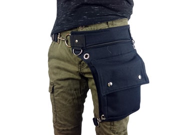 Utility belt with a belt with a swivel CLASP around the waist and a REMOVABLE leg strap on the thigh