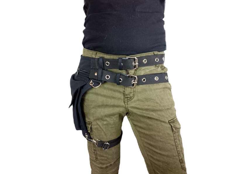Utility belt with a thigh strap to attach the bag to your leg, made of black organic cotton with a sturdy belt buckle
