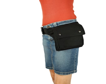 Handy hip bag with enough pockets, made of organic cotton, closing with a strong black click buckle