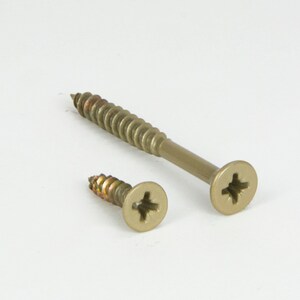 May include: Two gold-colored screws with Phillips head slots. The larger screw is about 2 inches long and the smaller screw is about 1 inch long.