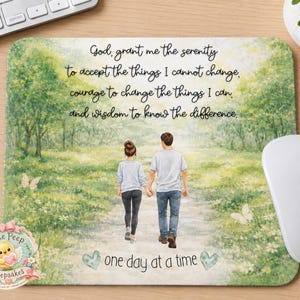 May include: A rectangular mouse pad featuring a watercolor illustration of two people walking away on a path through a green meadow. The text reads: God, grant me the serenity to accept the things I cannot change, courage to change the things I can, and wisdom to know the difference. one day at a time.