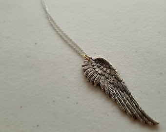 Angel wing necklace pendant in antique silver finish with a touch of gold | sympathy, love, thoughtful  gifts