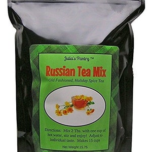 May include: A black resealable bag with a green label that says "Julia's Pantry™ Russian Tea Mix Old Fashioned, Holiday Spice Tea". The label also has a picture of a cup of tea and flowers.