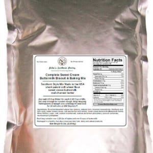May include: A silver bag of complete sweet cream buttermilk biscuit and baking mix. The bag has a nutrition facts label and text that reads "Southern Style Mix Made in the USA, short-patent soft wheat flour, real churned butter".