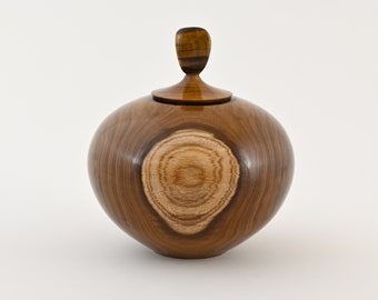 Small handmade wooden urn made of Laburnum with Tiger Eye on top (70 c.i.)