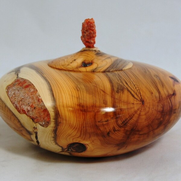 Hand turned wooden hollow form/burial urn made of Yew with red marble inlay
