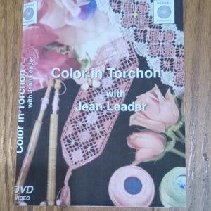 Learn Torchon Bobbin Lace Makings DVD or thumb drive.  After the basics try Color in Torchon by Jean Leader.  More info than in a book 56.50