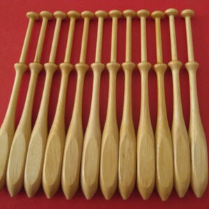 12x International square bobbins in single heads 23.50 dz for Bobbin Lace making. Acacia wood too 27.50 dz. also known as Square Danish